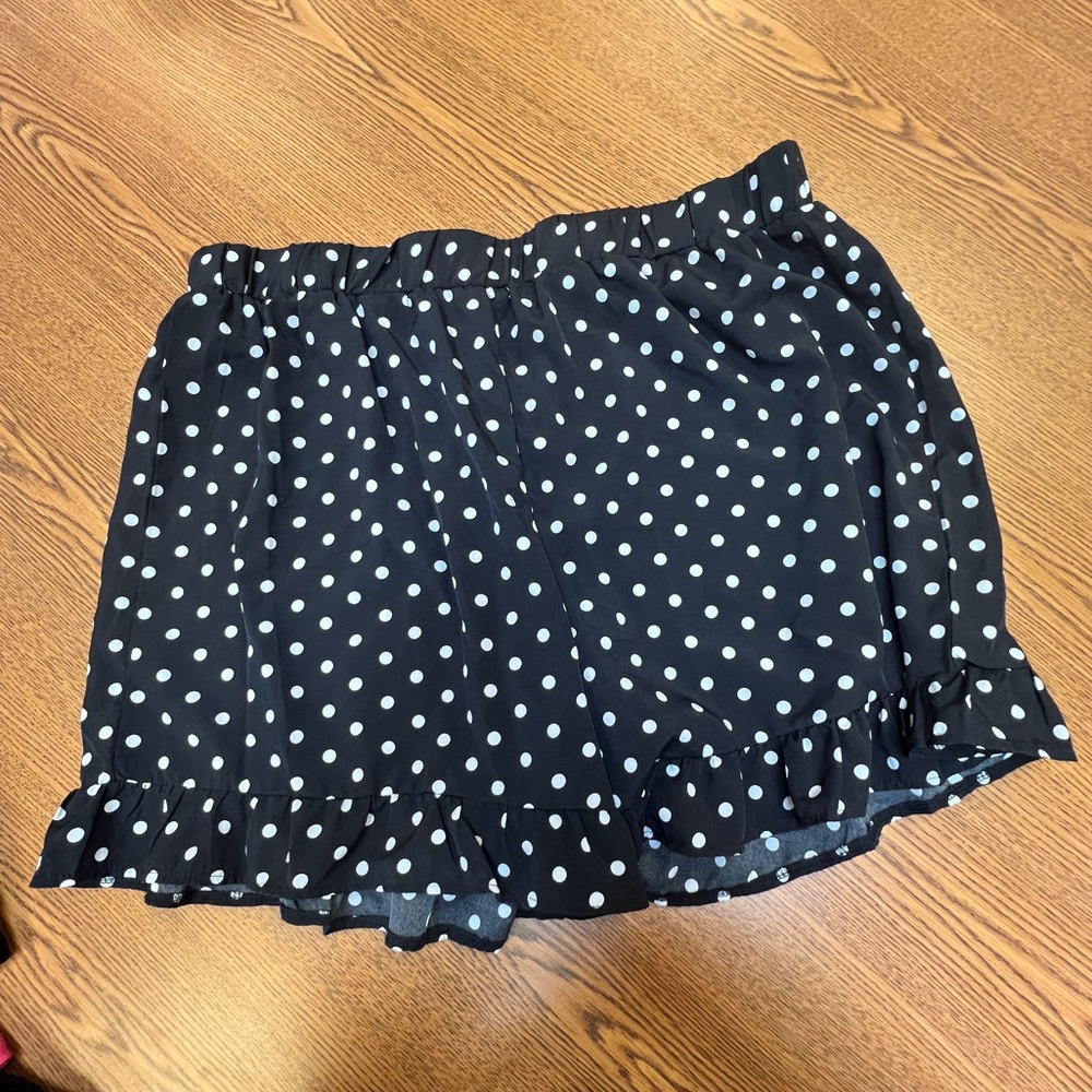 Black polkadot shorts.